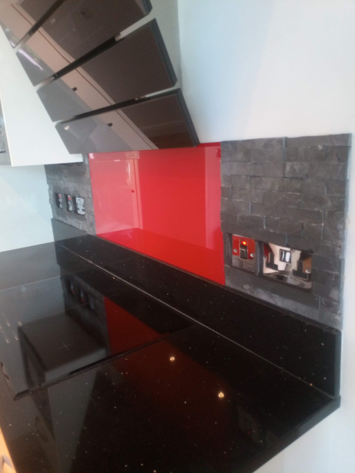 Modern Kitchen with Red Glass Splashback